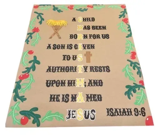 Hand-painted Isaiah 9:6 Christmas banner with the word CHRISTMAS running down the verse as a gold acrostic, framed by holly and berries